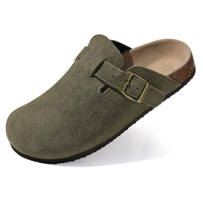 Green suede clog shoe with a buckle on a white background