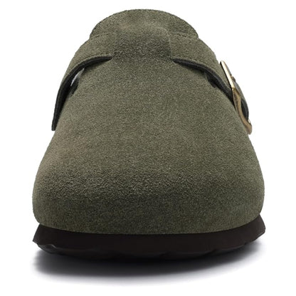 Green suede shoe with a strap on a white background