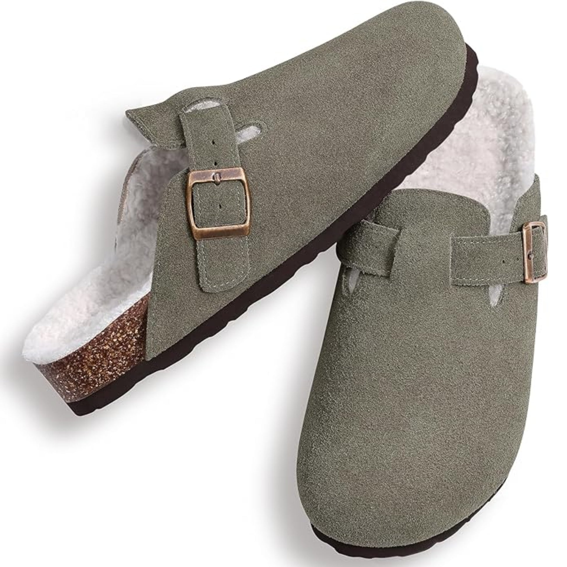 Pair of green slippers with fur lining on a white background
